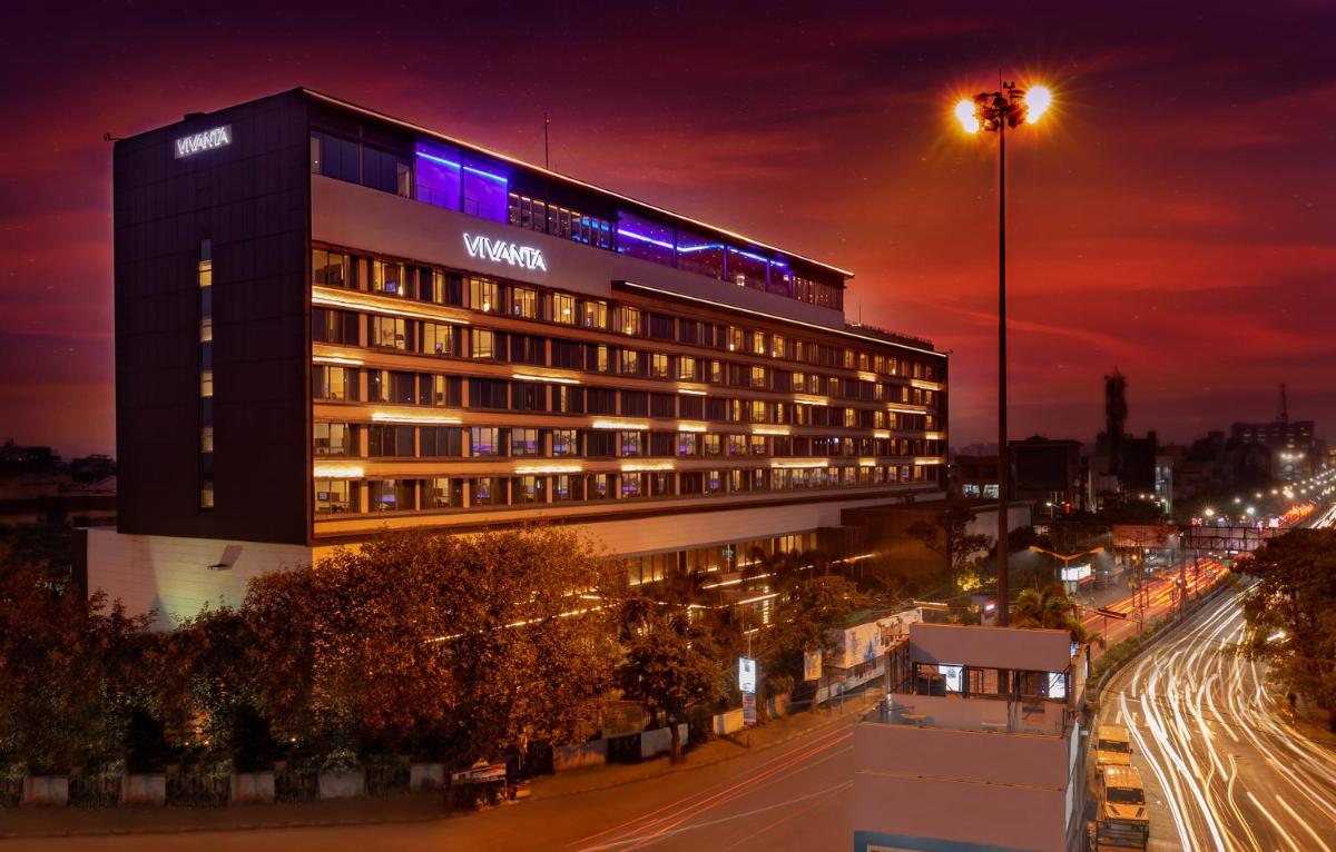 a hotel building with purple lights on top of it at Vivanta Kolkata EM Bypass in Kolkata