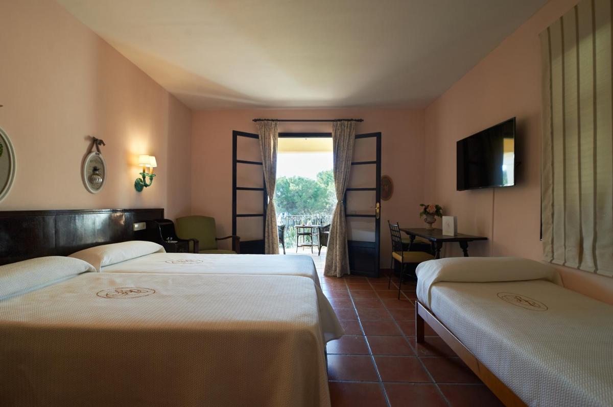 Cama o camas de una habitación en Hotel Bahia