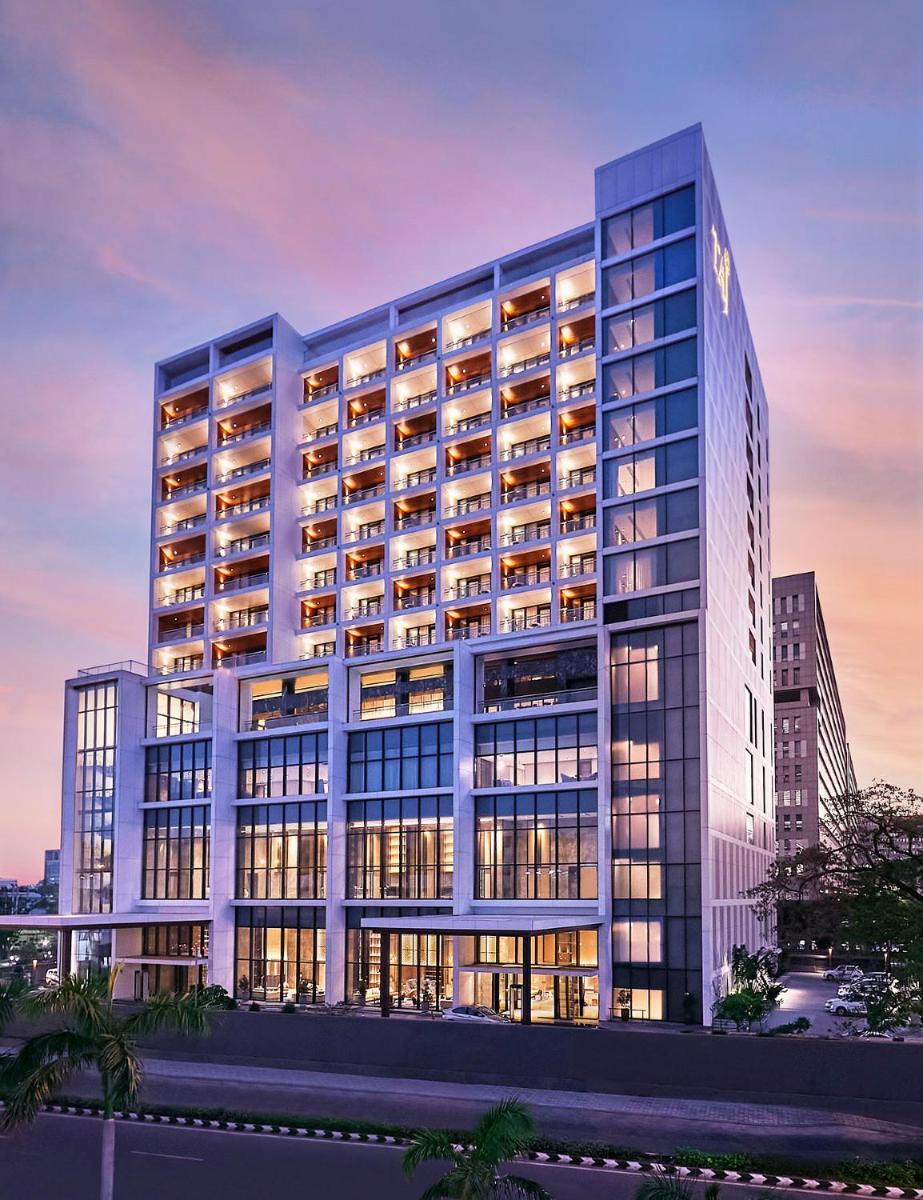 a rendering of a large office building at dusk at Taj Wellington Mews Chennai in Chennai