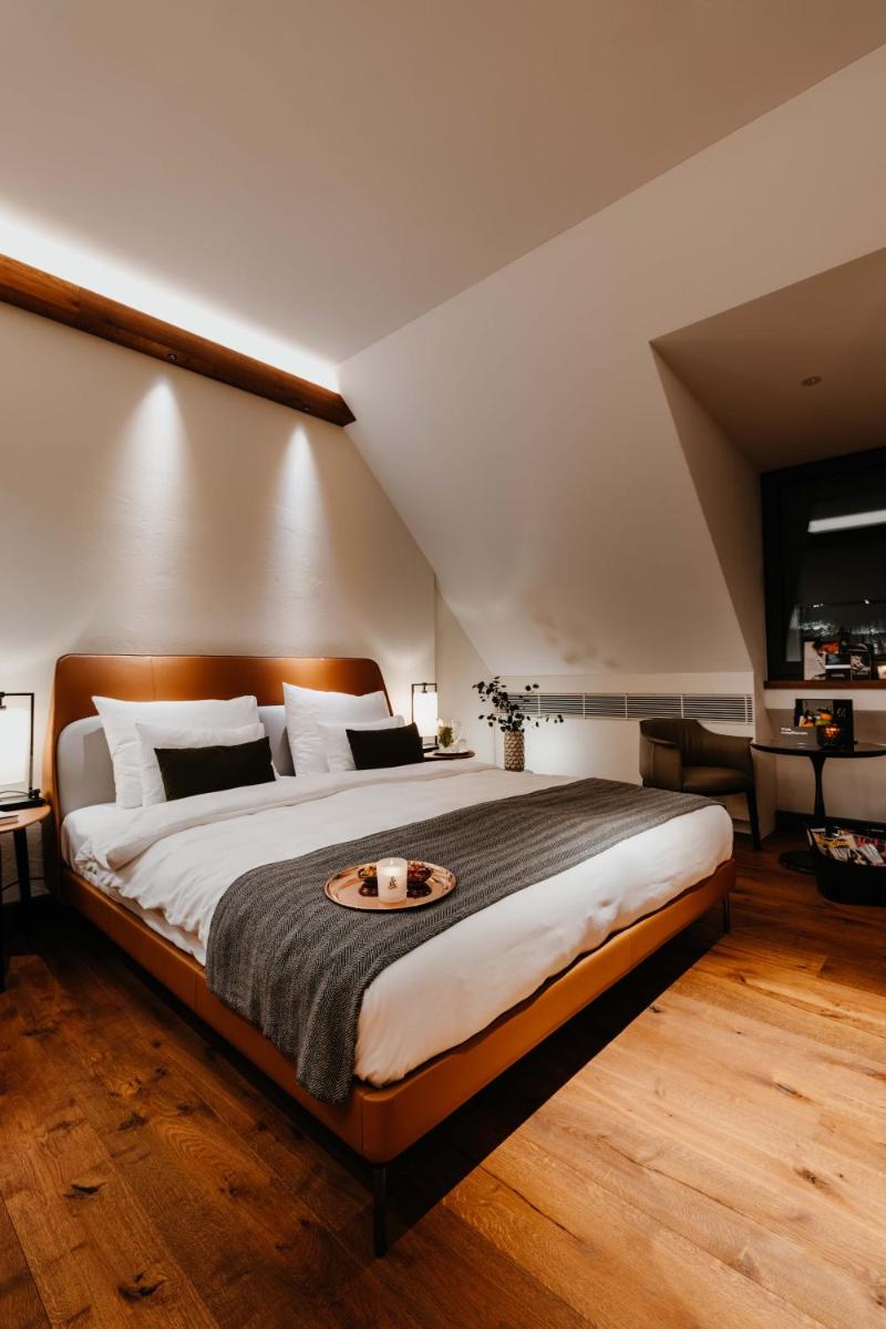 Ein Bett oder Betten in einem Zimmer der Unterkunft DO & CO Hotel München Ein Bett oder Betten in einem Zimmer der Unterkunft DO & CO Hotel München