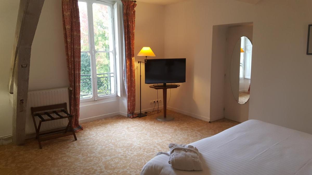 Un ou plusieurs lits dans un hébergement de l'établissement Hôtel Villa Navarre