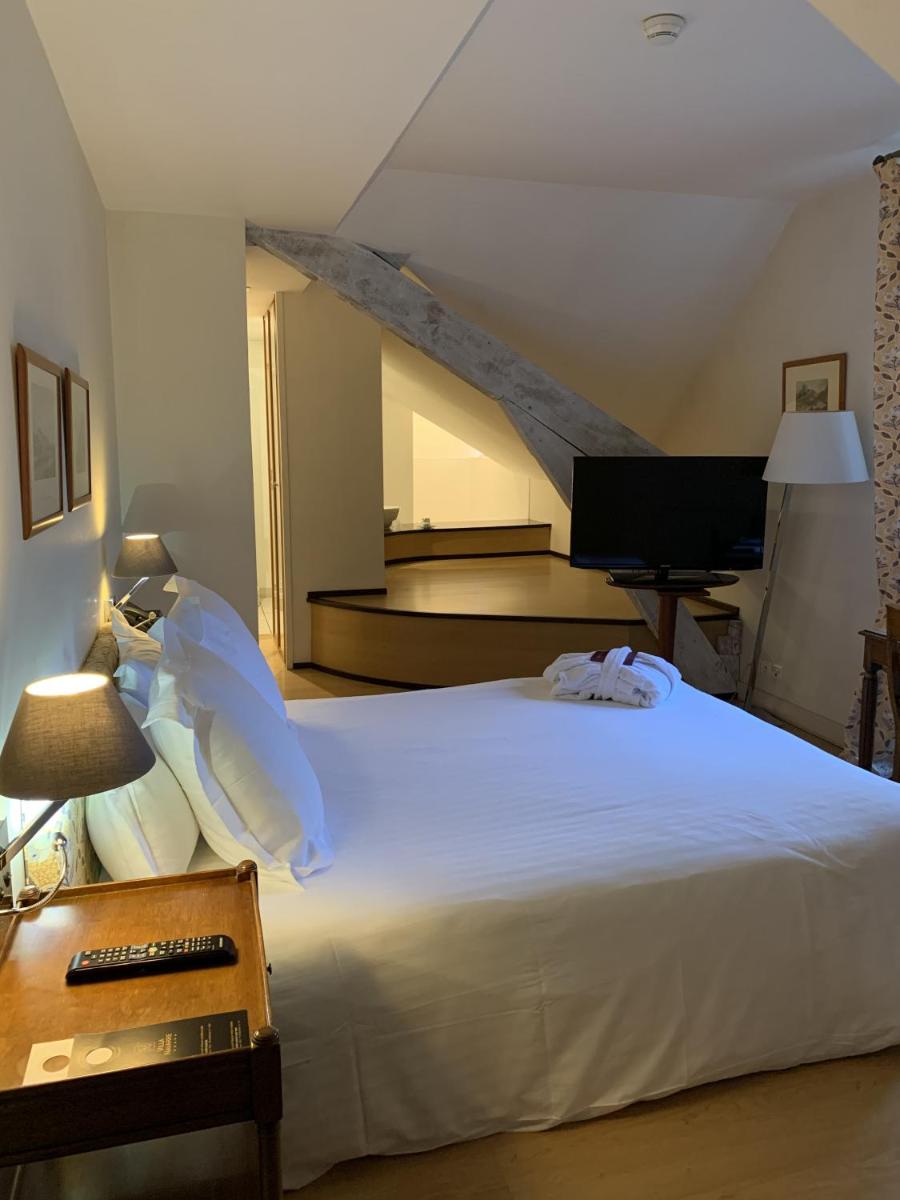 Un ou plusieurs lits dans un hébergement de l'établissement Hôtel Villa Navarre