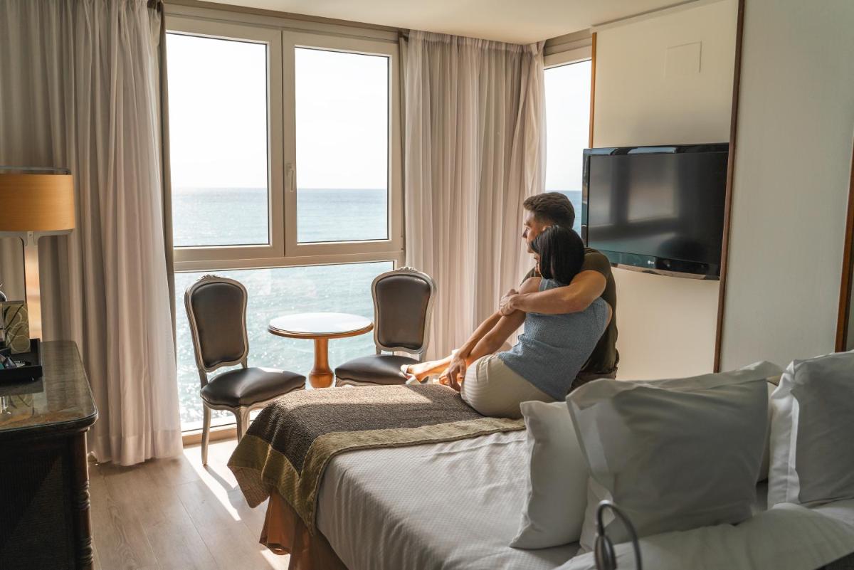 Una televisión o centro de entretenimiento en Hotel Boutique Villa Venecia