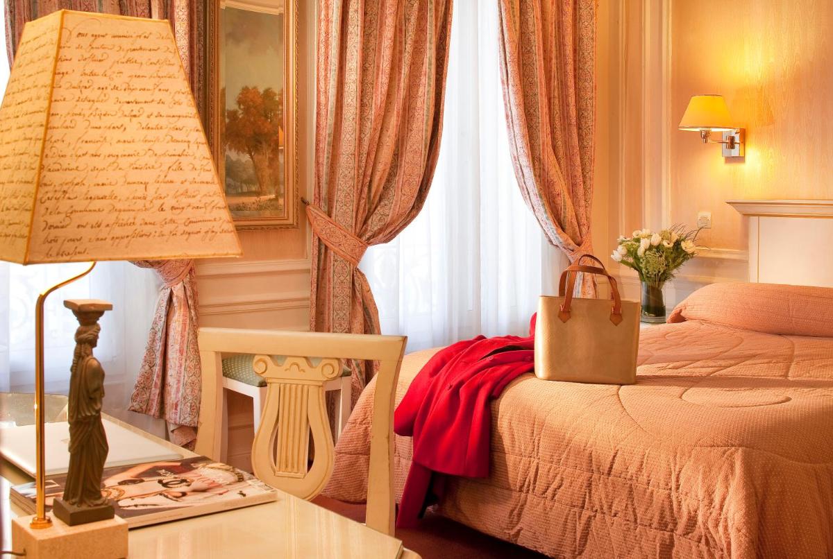 Un ou plusieurs lits dans un hébergement de l'établissement Hotel & Spa Saint-Jacques