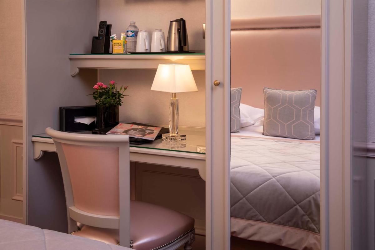 Un ou plusieurs lits dans un hébergement de l'établissement Hotel & Spa Saint-Jacques