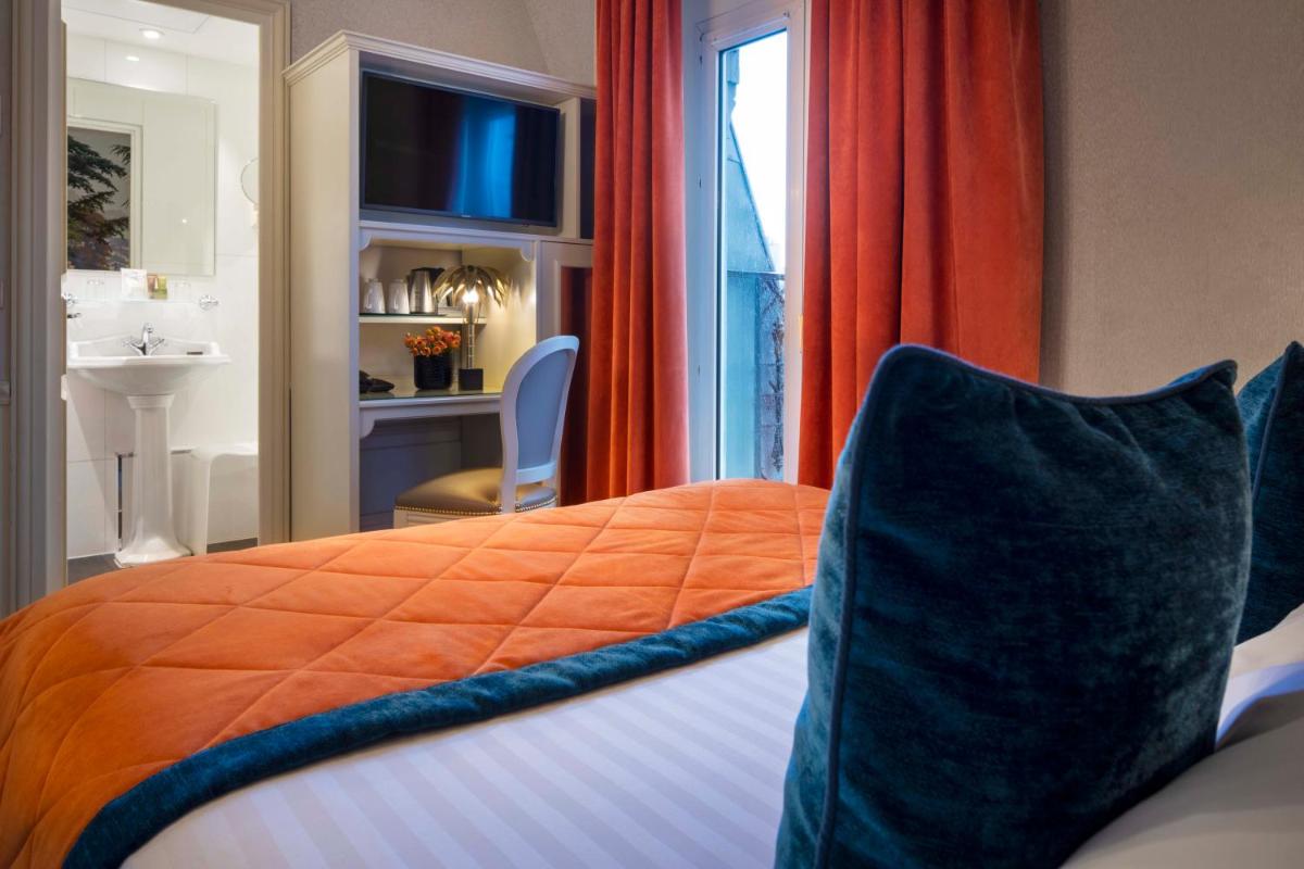 Un ou plusieurs lits dans un hébergement de l'établissement Hotel & Spa Saint-Jacques