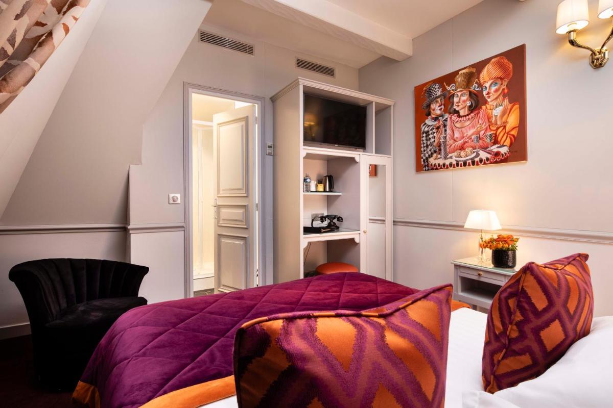 Un ou plusieurs lits dans un hébergement de l'établissement Hotel & Spa Saint-Jacques