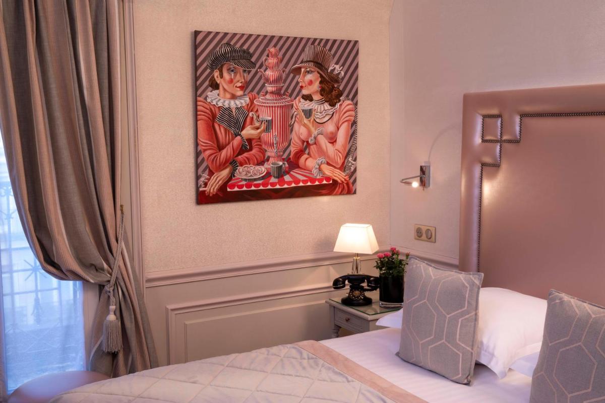 Un ou plusieurs lits dans un hébergement de l'établissement Hotel & Spa Saint-Jacques