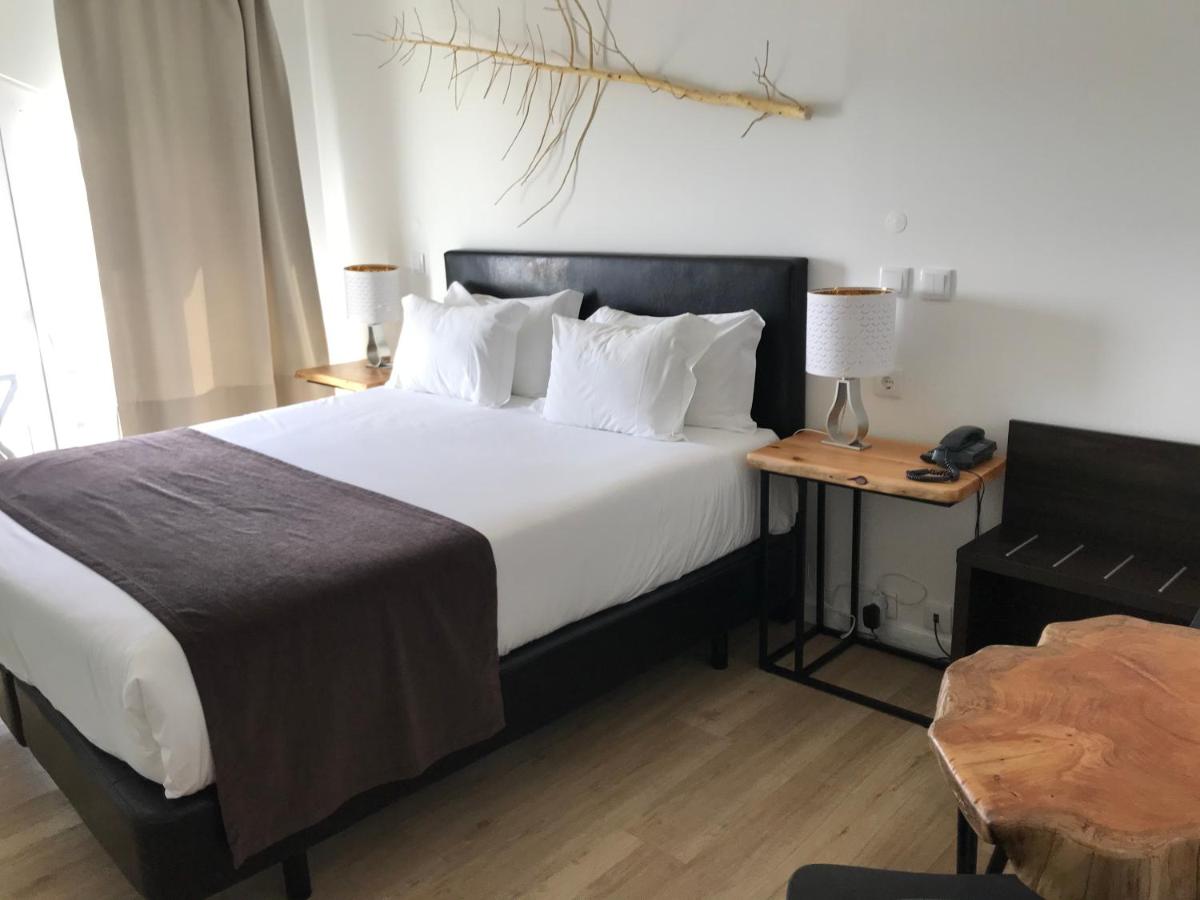 Uma cama ou camas num quarto em Promar - Eco Beach & Spa Hotel