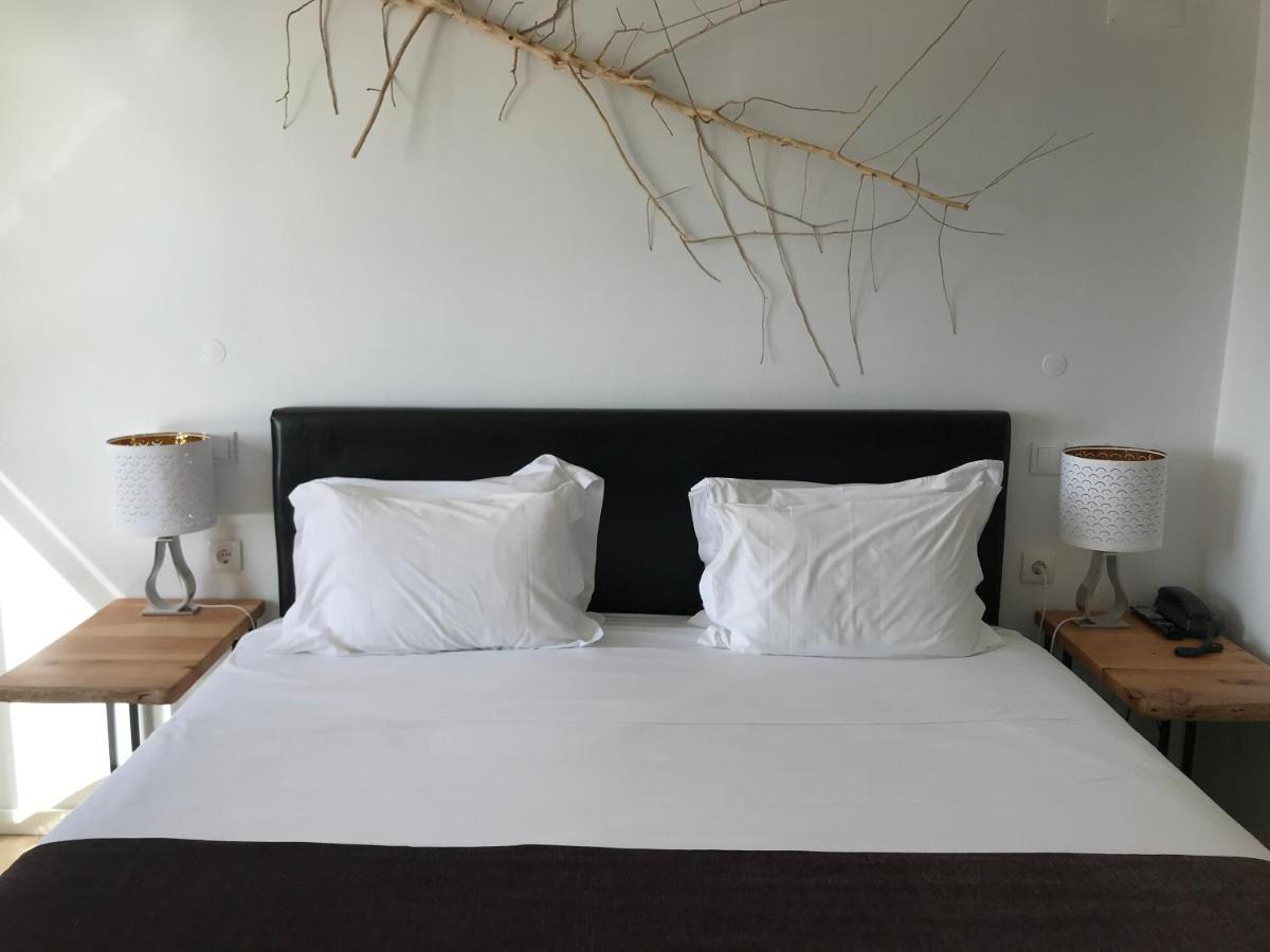 Uma cama ou camas num quarto em Promar - Eco Beach & Spa Hotel