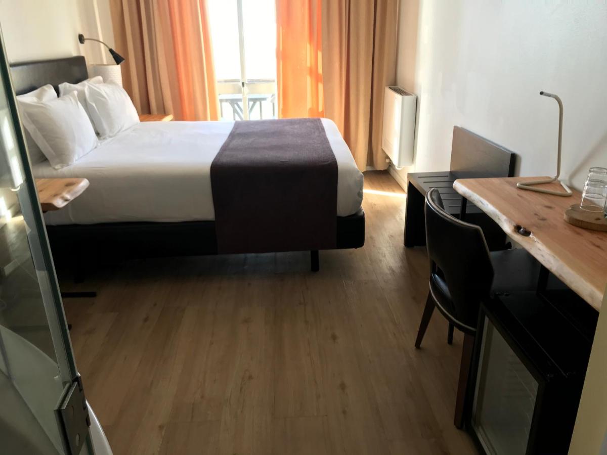 Uma cama ou camas num quarto em Promar - Eco Beach & Spa Hotel
