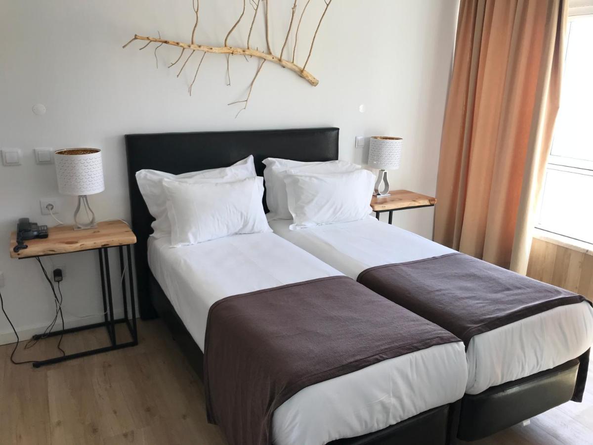 Uma cama ou camas num quarto em Promar - Eco Beach & Spa Hotel