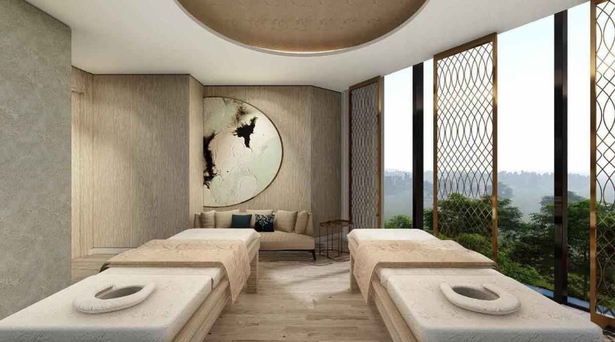 a bedroom with three beds and a window at The Leela Bhartiya City Bengaluru in Bengaluru a bedroom with three beds and a window at The Leela Bhartiya City Bengaluru in Bengaluru