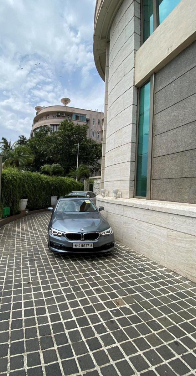 a car parked in front of a building at InterContinental Marine Drive Mumbai by IHG in Mumbai