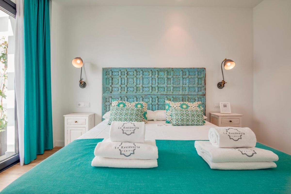 Cama o camas de una habitación en La Residencia Puerto Hotel & Spa