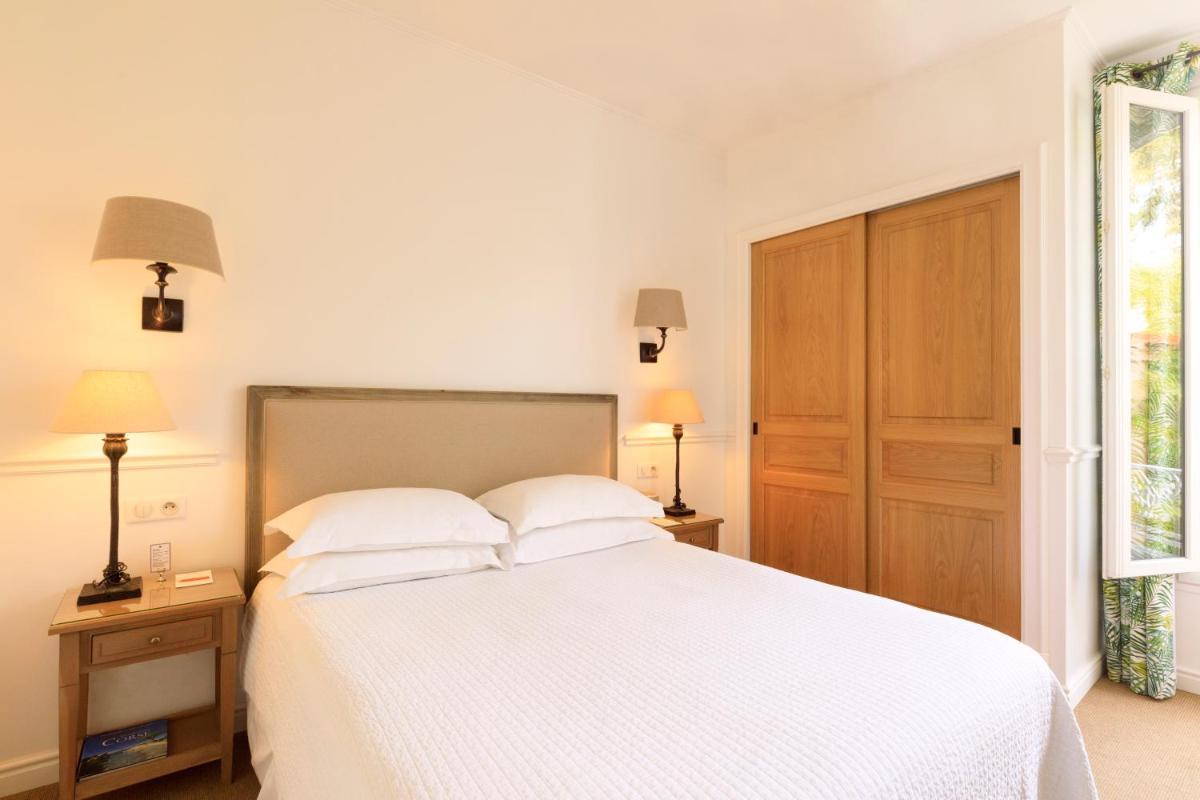 Un ou plusieurs lits dans un hébergement de l'établissement Hôtel Les Mouettes - Teritoria