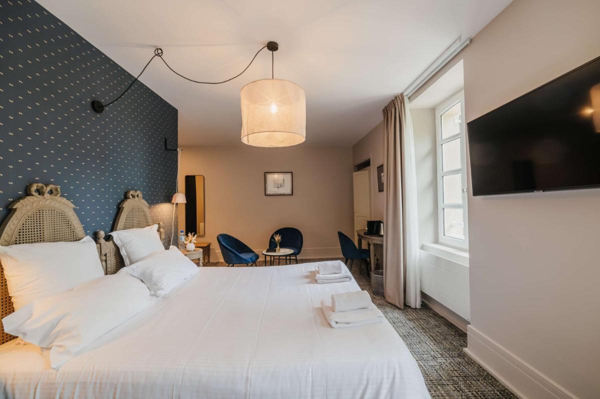 Un ou plusieurs lits dans un hébergement de l'établissement Hôtel La Robéyère - BW Signature Collection
