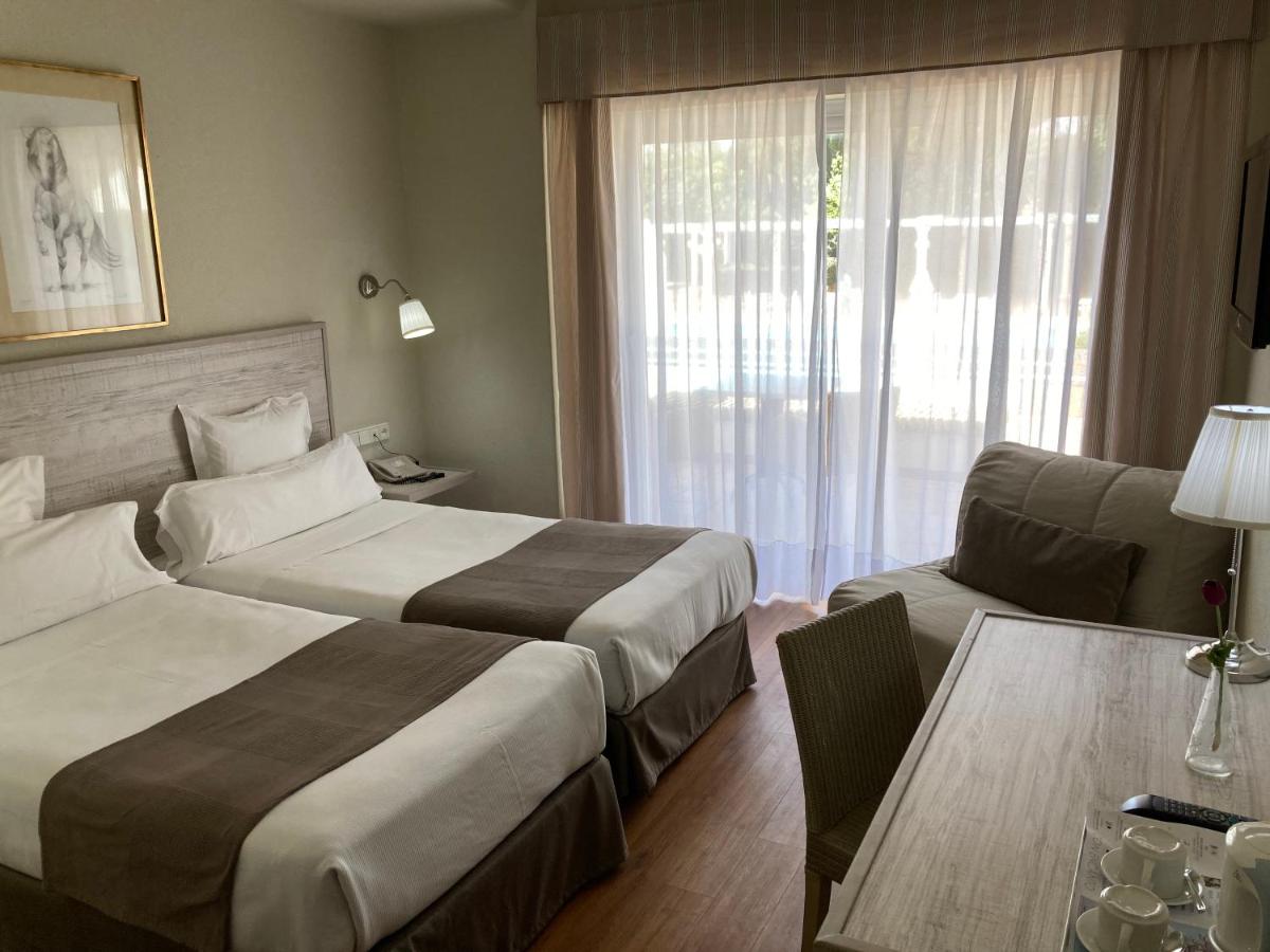 Cama o camas de una habitación en Hotel Jerez & Spa