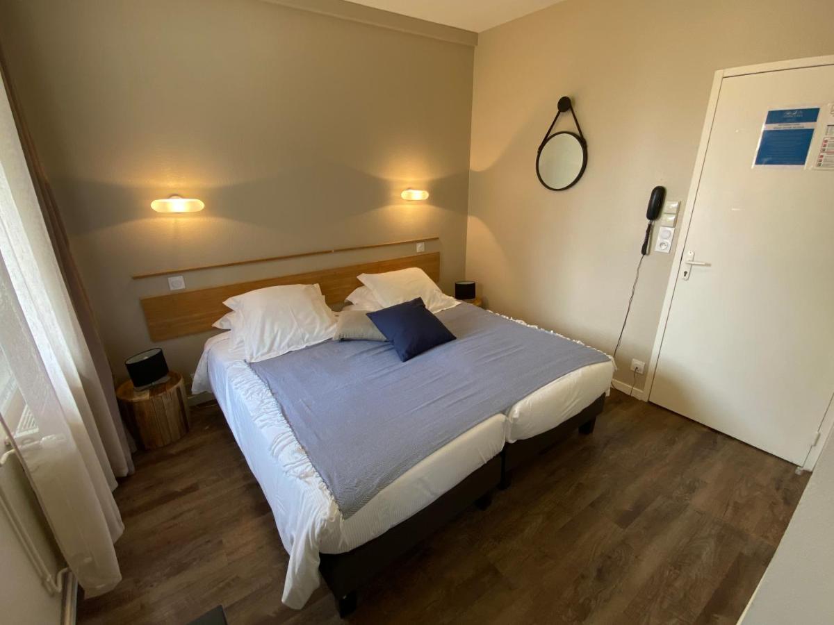 Un ou plusieurs lits dans un hébergement de l'établissement Hôtel de charme & SPA Le Grand Large