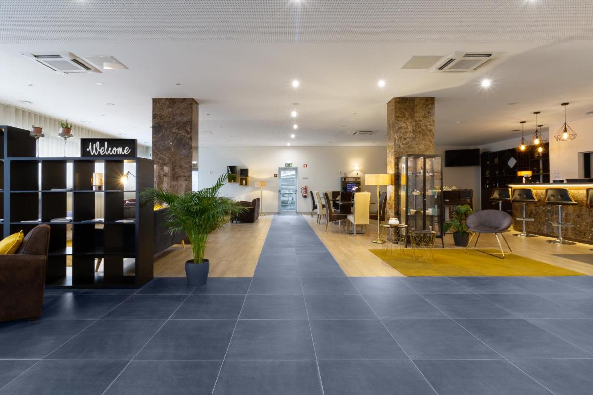 A área de receção ou átrio de In Gold Hotel & Spa