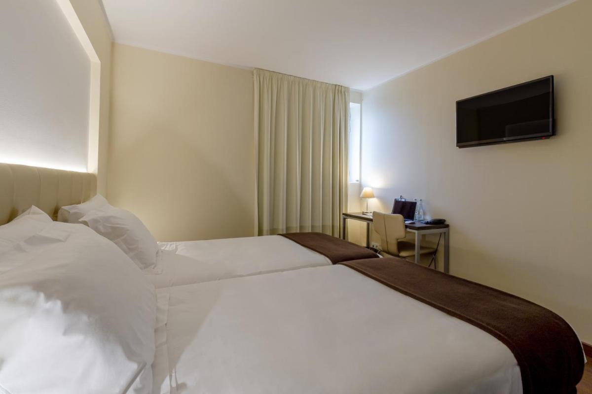 Uma cama ou camas num quarto em In Gold Hotel & Spa