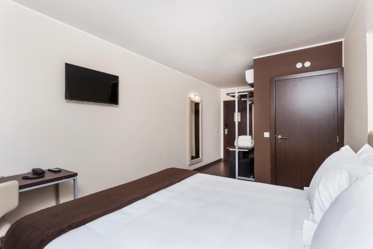 Uma cama ou camas num quarto em In Gold Hotel & Spa