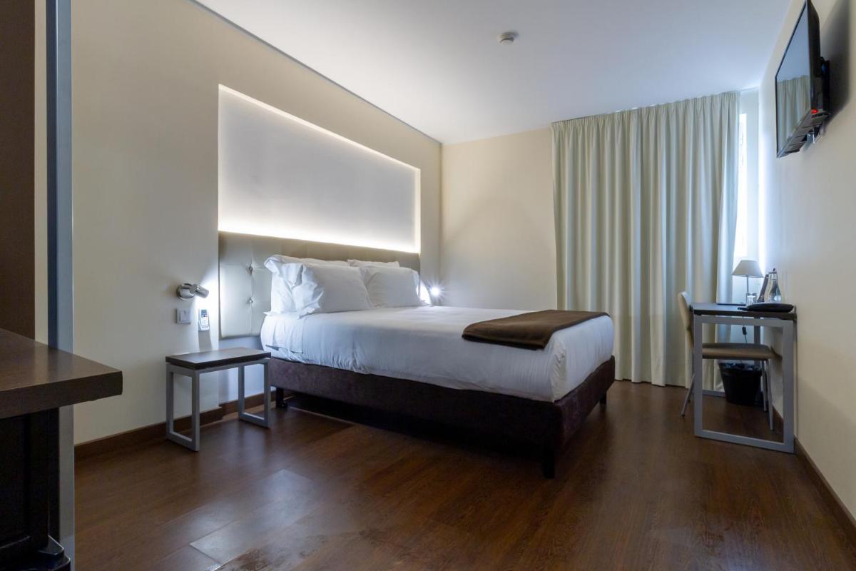 Uma cama ou camas num quarto em In Gold Hotel & Spa