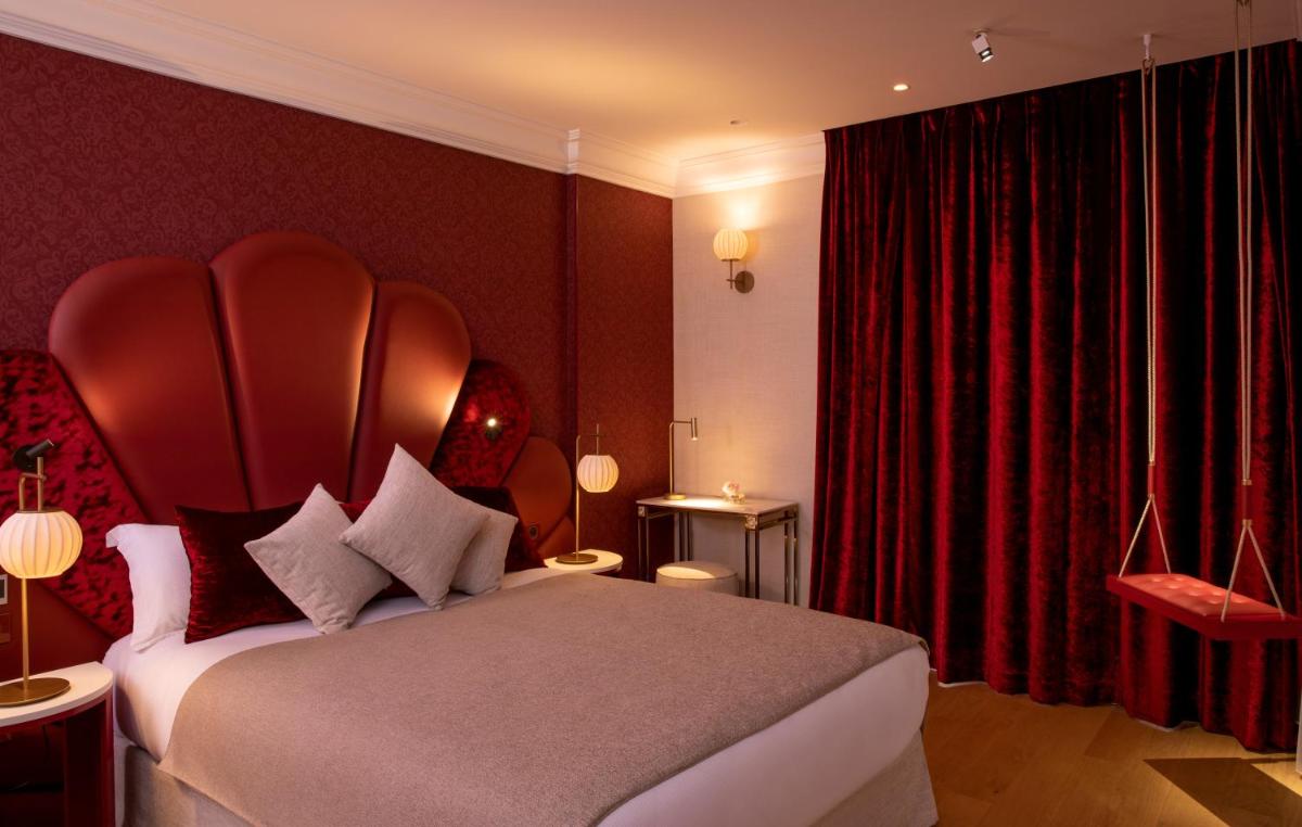 Un ou plusieurs lits dans un hébergement de l'établissement Paris j'Adore Hotel & Spa