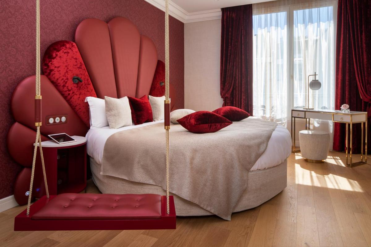 Un ou plusieurs lits dans un hébergement de l'établissement Paris j'Adore Hotel & Spa
