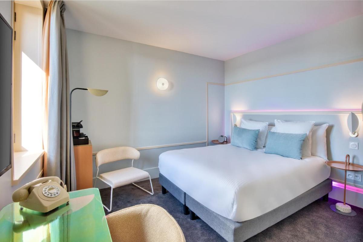 Un ou plusieurs lits dans un hébergement de l'établissement Aiden by Best Western Clermont-Ferrand Hotel & Spa