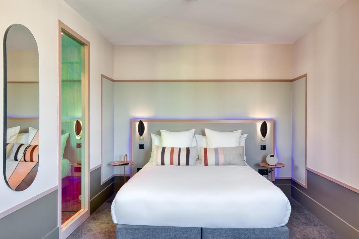 Un ou plusieurs lits dans un hébergement de l'établissement Aiden by Best Western Clermont-Ferrand Hotel & Spa