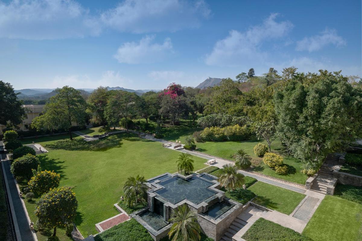 an aerial view of a large garden with palm trees at Trident Udaipur in Udaipur