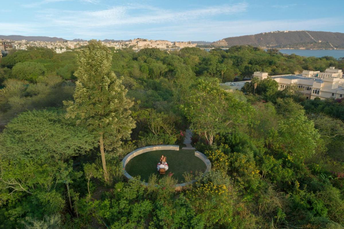 an overhead view of a park with a person sitting on the grass at Trident Udaipur in Udaipur