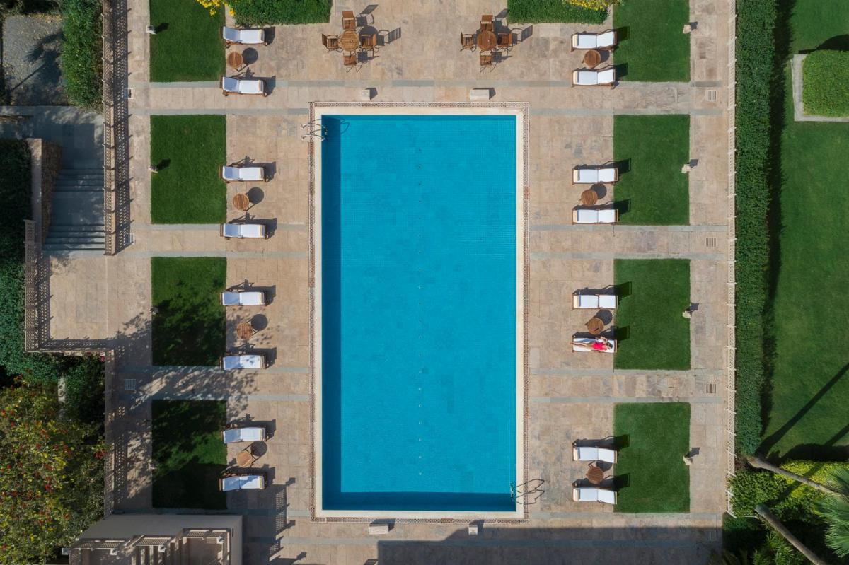 an overhead view of a large blue pool at Trident Udaipur in Udaipur