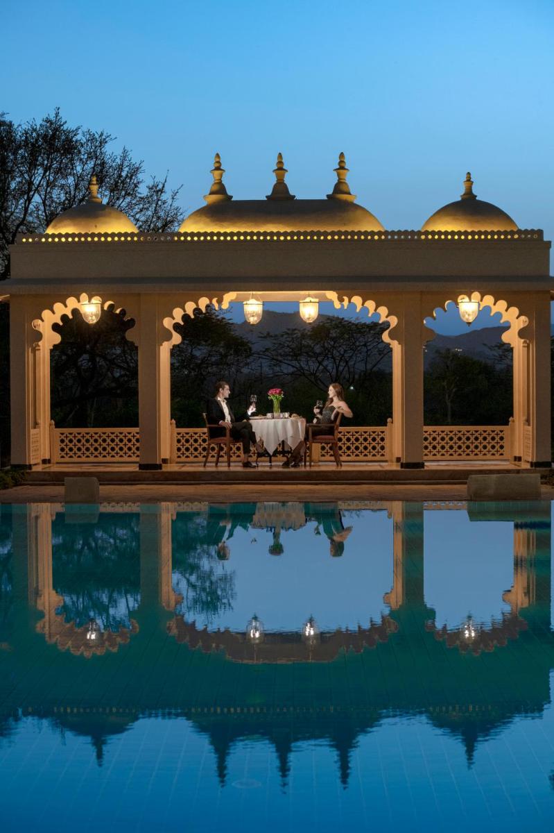 a gazebo with people sitting at a table at Trident Udaipur in Udaipur