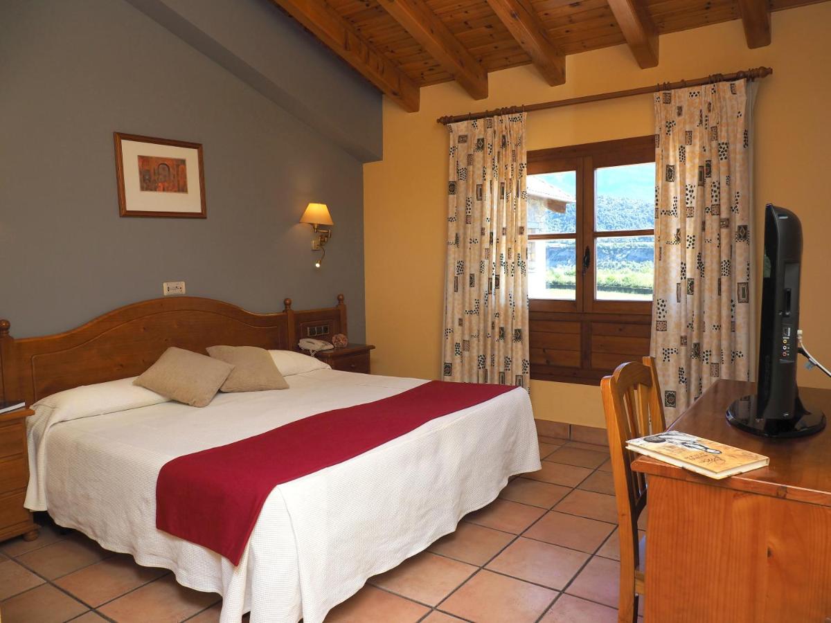 Cama o camas de una habitación en Hotel & SPA Peña Montañesa