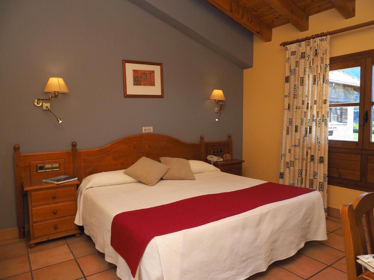 Cama o camas de una habitación en Hotel & SPA Peña Montañesa