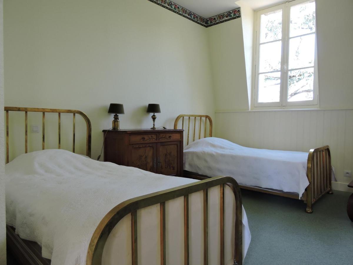 Un ou plusieurs lits dans un hébergement de l'établissement Le Domaine de Mestré, The Originals Relais