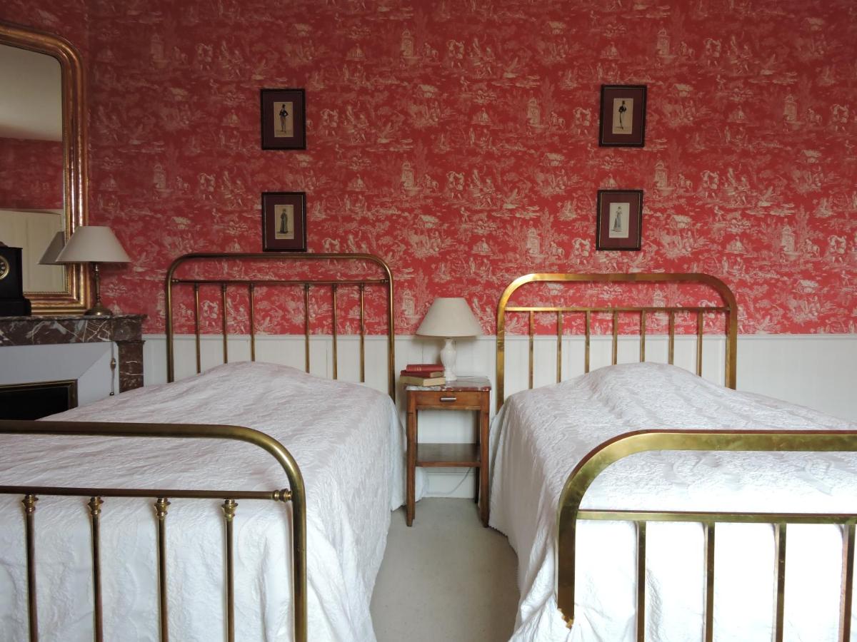 Un ou plusieurs lits dans un hébergement de l'établissement Le Domaine de Mestré, The Originals Relais