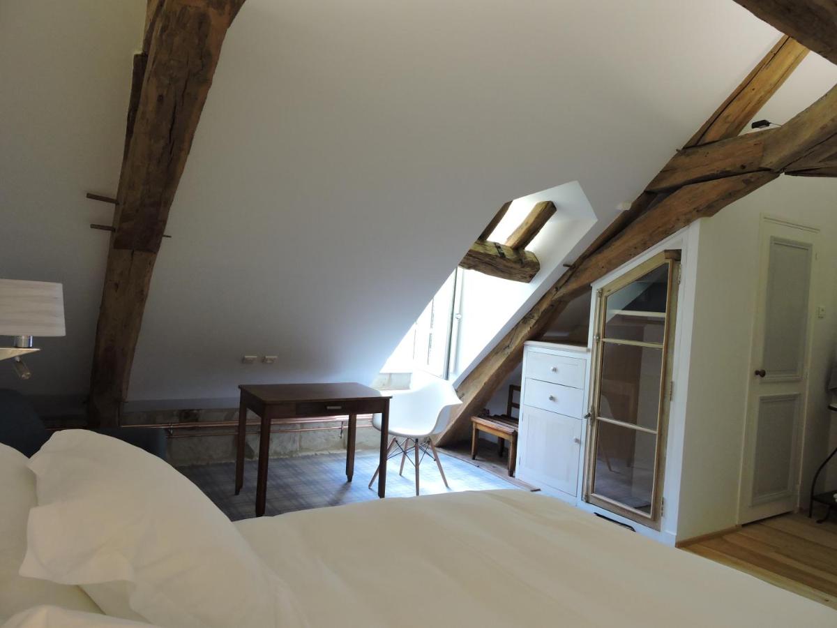 Un ou plusieurs lits dans un hébergement de l'établissement Le Domaine de Mestré, The Originals Relais