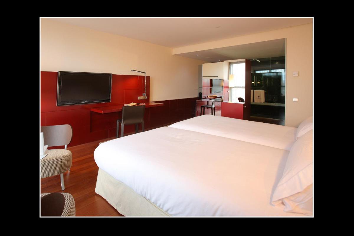 Cama o camas de una habitación en Hotel Reina Petronila