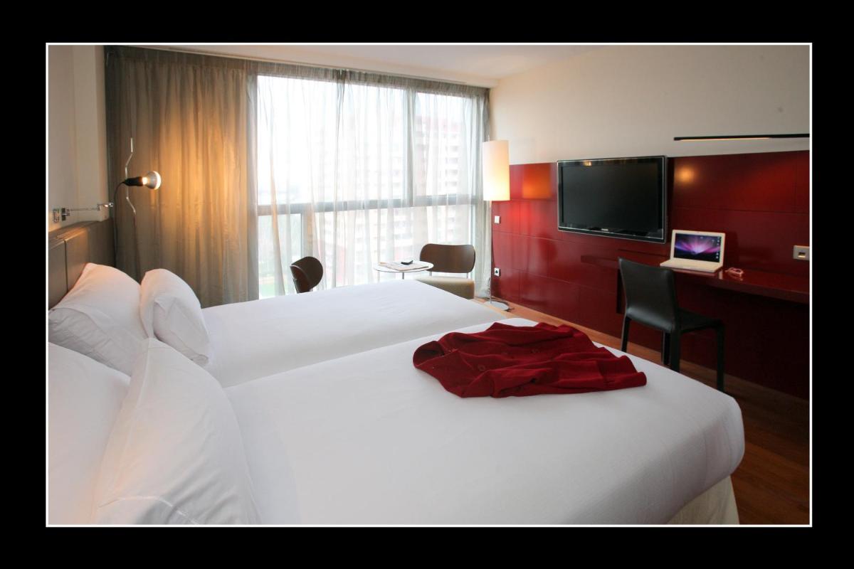 Cama o camas de una habitación en Hotel Reina Petronila