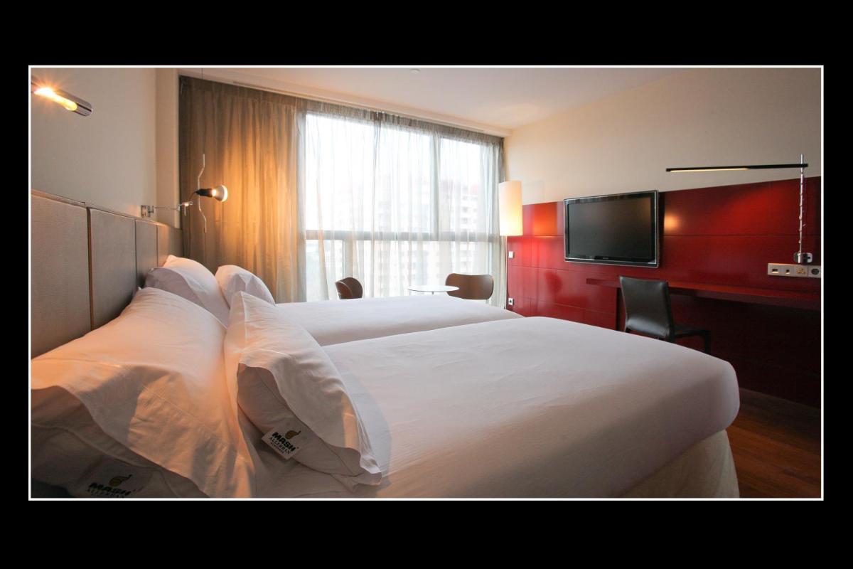 Cama o camas de una habitación en Hotel Reina Petronila