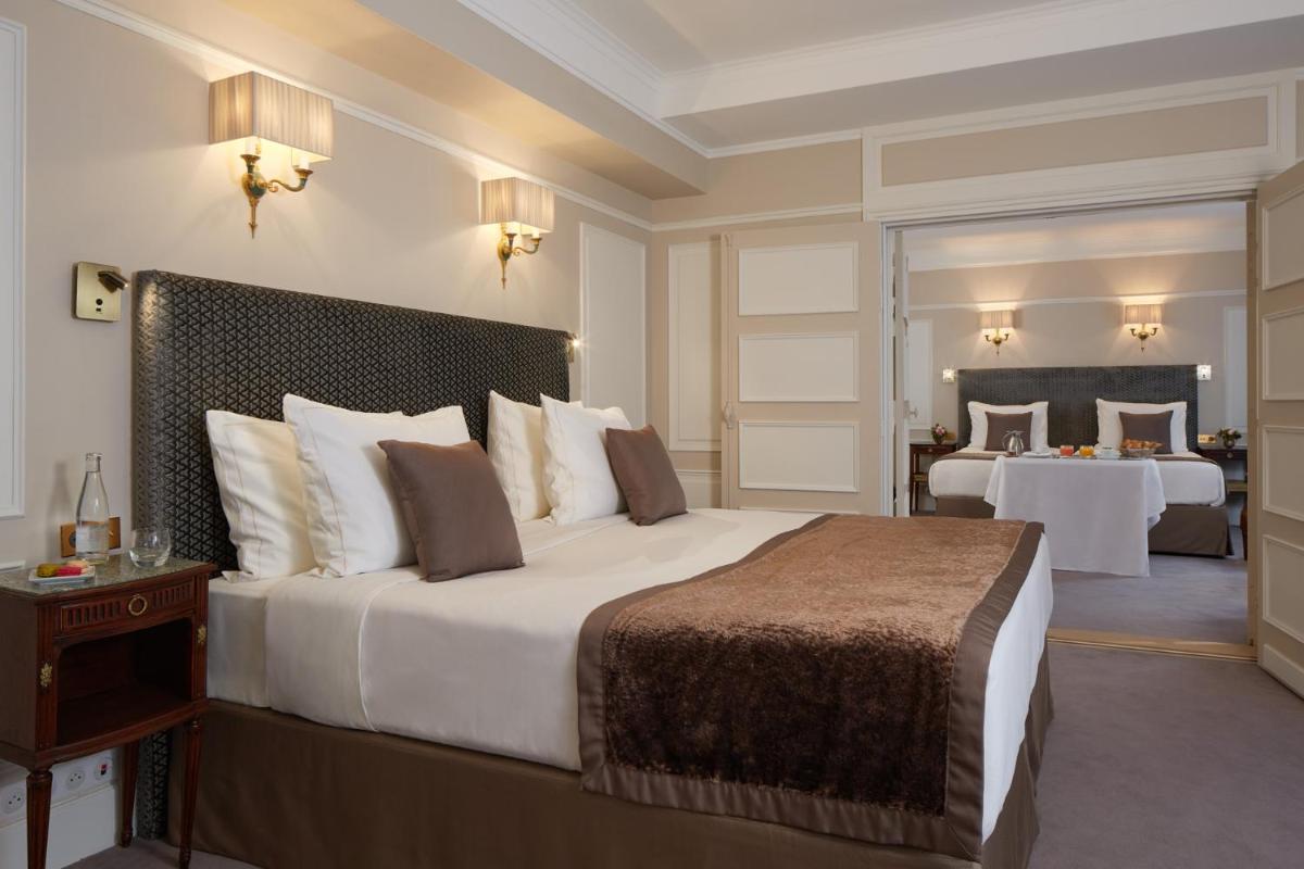 Un ou plusieurs lits dans un hébergement de l'établissement Majestic Hotel Spa - Champs Elysées