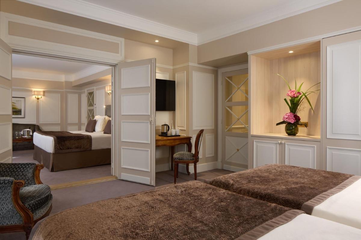 Un ou plusieurs lits dans un hébergement de l'établissement Majestic Hotel Spa - Champs Elysées