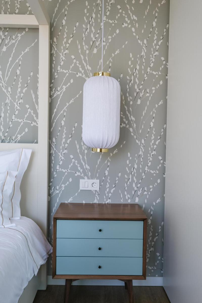 Uma cama ou camas num quarto em Hotel Vouga
