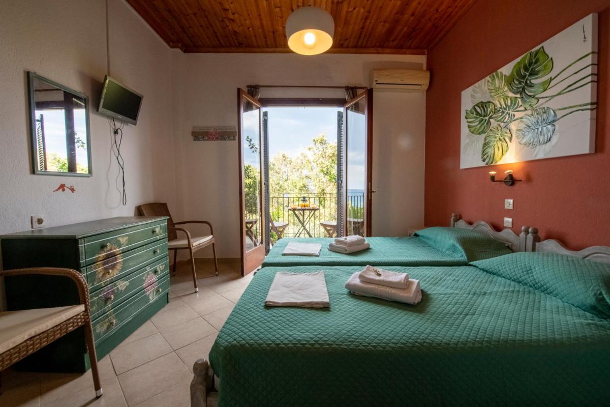 Katerina Fotopoulos Rooms & Apartments - Papanero com - Housity