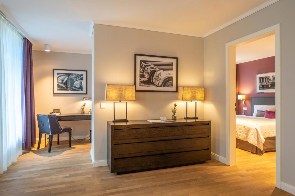 Ein Bett oder Betten in einem Zimmer der Unterkunft VILA VITA Rosenpark Ein Bett oder Betten in einem Zimmer der Unterkunft VILA VITA Rosenpark