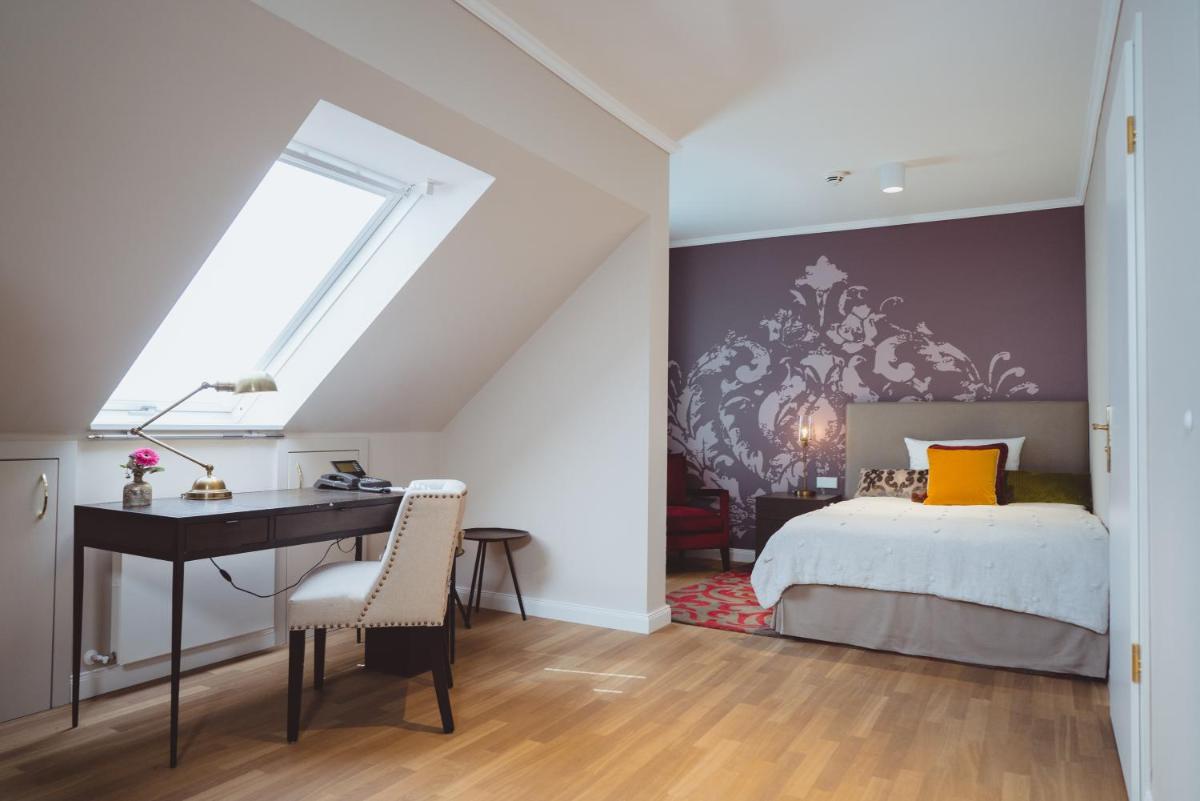 Ein Bett oder Betten in einem Zimmer der Unterkunft VILA VITA Rosenpark Ein Bett oder Betten in einem Zimmer der Unterkunft VILA VITA Rosenpark