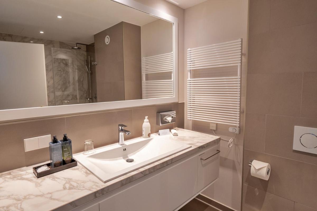 Ein Badezimmer in der Unterkunft VILA VITA Rosenpark Ein Badezimmer in der Unterkunft VILA VITA Rosenpark